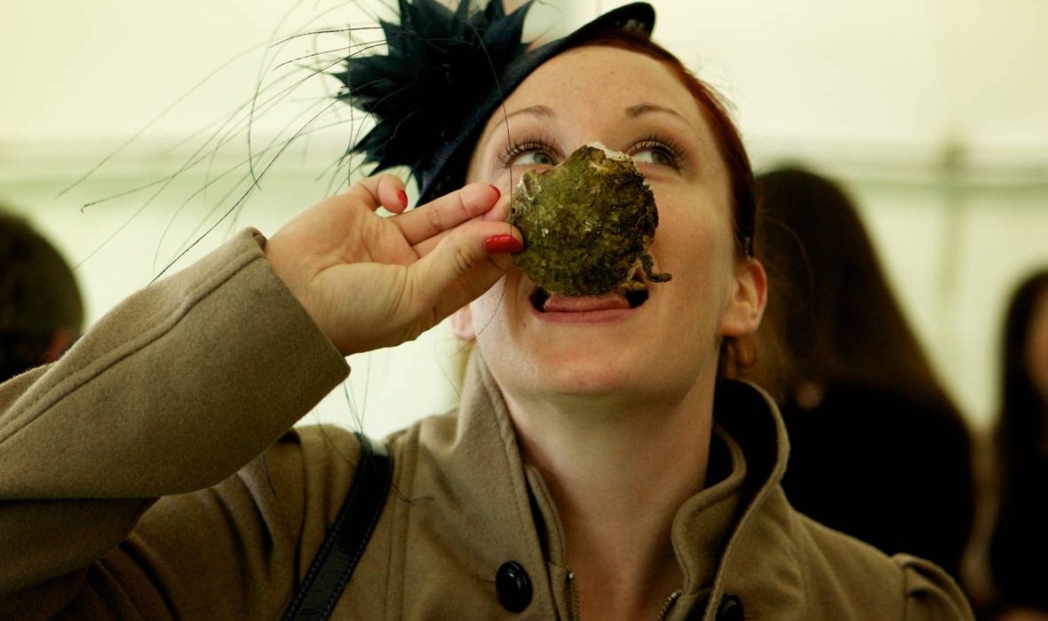 Woman eating Galway Oysters